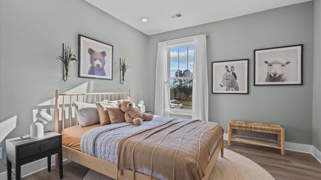 New two story home in Woodruff, SC with secondary bedroom with hardwood flooring at Pinebrook by DRB Homes New two story home in Woodruff, SC with secondary bedroom with hardwood flooring at Pinebrook by DRB Homes