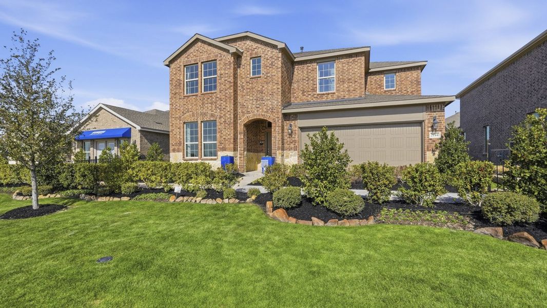 Front exterior of a home in the The Woods at Lindsey Place community, located in Anna, TX (Image 6).
