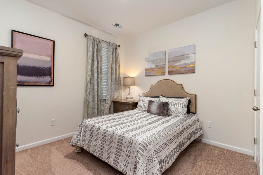 Furnished interior in a model home at Island Green in Myrtle Beach (Image 49).