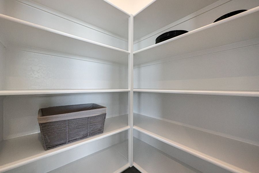 A white shelf with a vent. A white shelf with a vent.