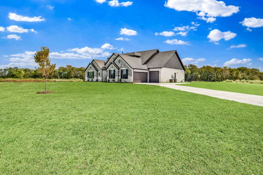 Front exterior of a home in the Panther Trail community, located in Van Alstyne, TX (Image 11).