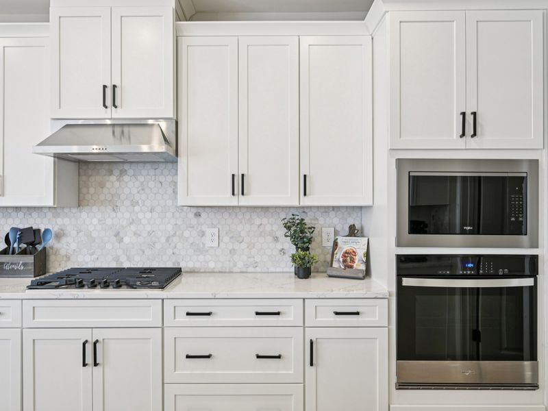 Kitchen in the Johnson floorplan at a Meritage Homes community in Raleigh, NC. Kitchen in the Johnson floorplan at a Meritage Homes community in Raleigh, NC.
