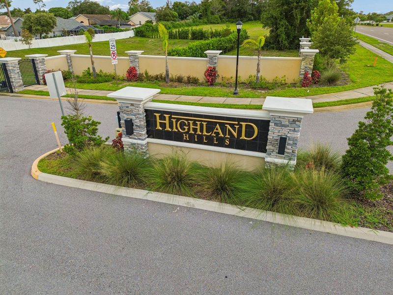 Entrance to the Highland Hills community in Hudson, FL, featuring signage and landscaping (Image 13).