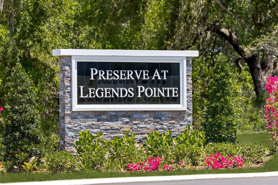Entrance to the The Preserve at Legends Pointe II community in Hudson, FL, featuring signage and landscaping (Image 1).