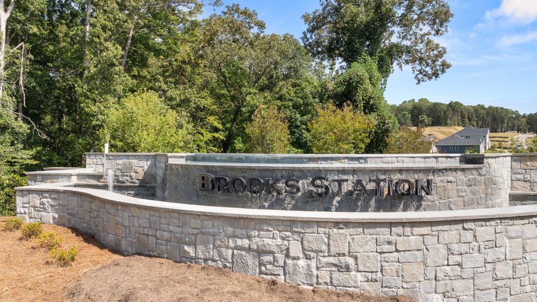Entrance to the Brooks Station community in Dacula, GA, featuring signage and landscaping (Image 1). Entrance to the Brooks Station community in Dacula, GA, featuring signage and landscaping (Image 1).