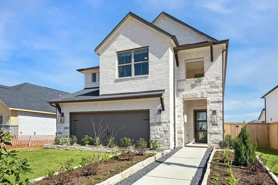 Front exterior of a home in the Candela South community, located in Richmond, TX (Image 4).