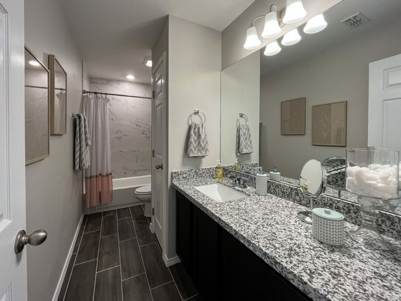 Furnished interior in a model home at Villas San Agustin in Laredo (Image 8).