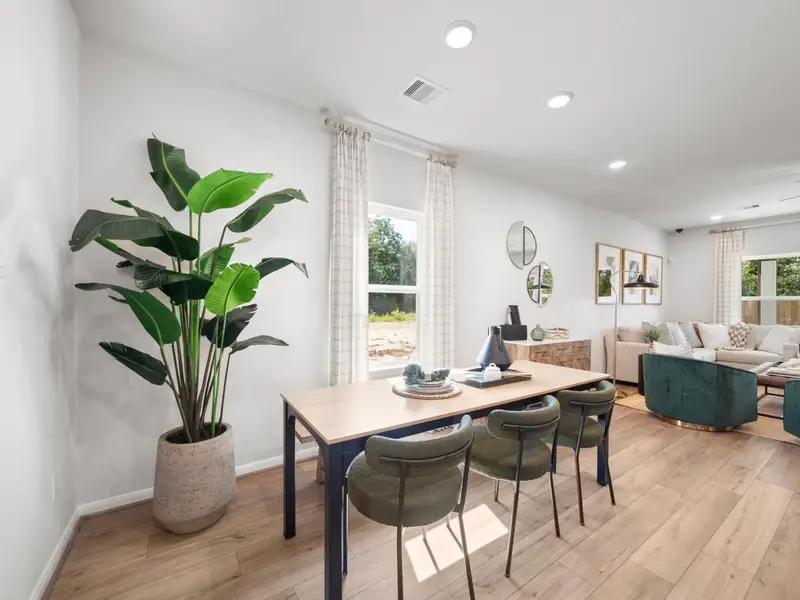 Furnished interior in a model home at Caney Creek Place in Conroe (Image 7).
