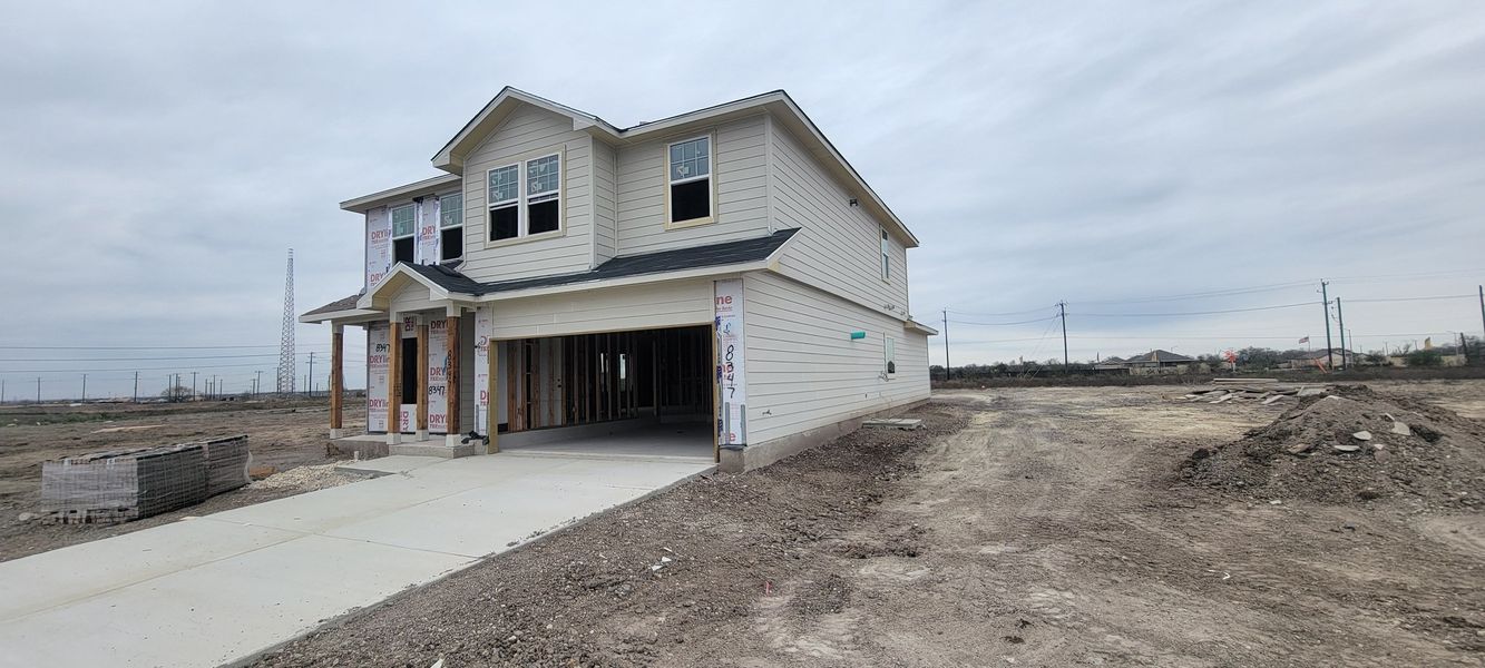 A spacious two-story home under construction in Red Hawk Landing by CastleRock Communities (San Antonio, TX).