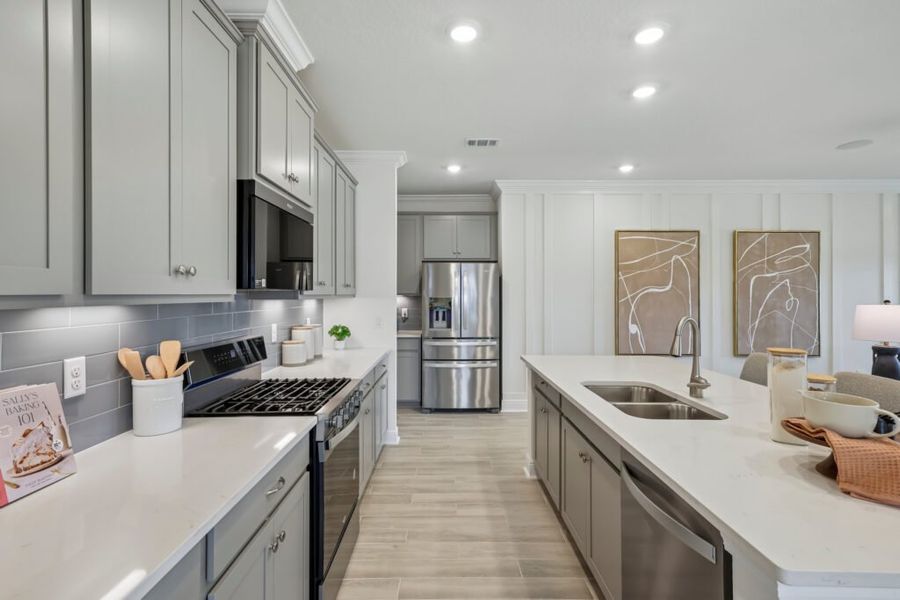 Furnished interior in a model home at Mahogany At Jubilee in Pace (Image 7).