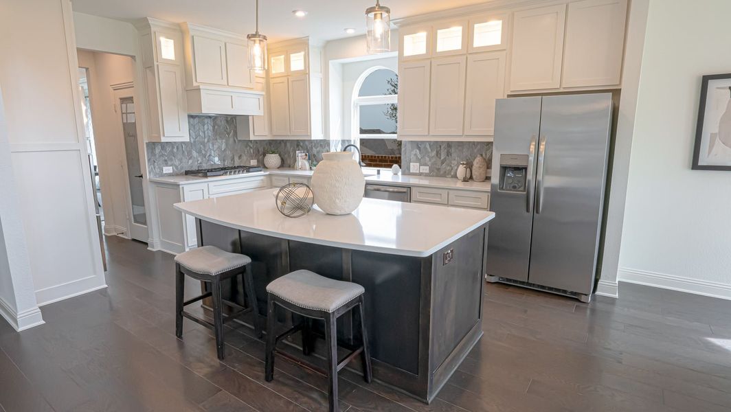 Furnished interior in a model home at High Country in Burleson (Image 1).