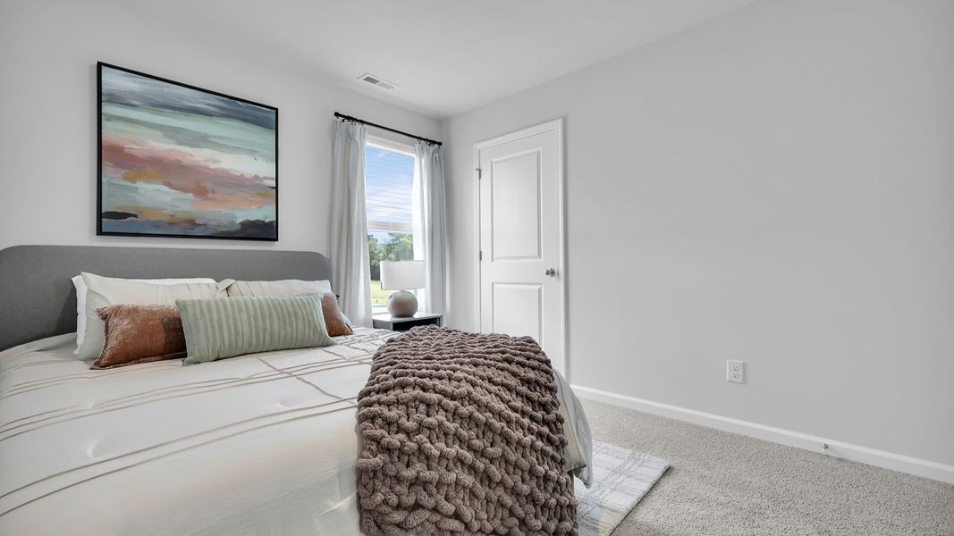 Furnished interior in a model home at The Ranch in Holly Hill (Image 28).