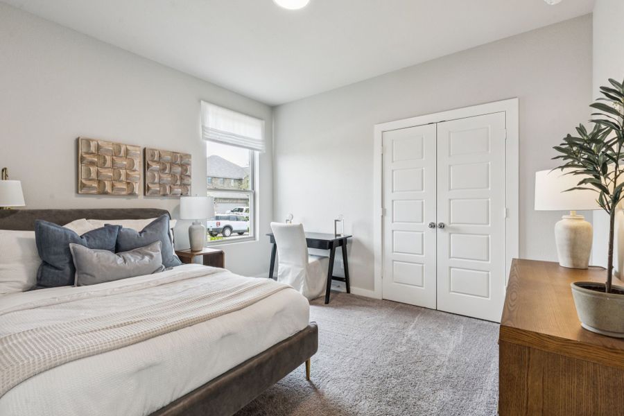 REPRESENTATIVE PHOTO – Bedroom in a Lakehaven Wimbledon model home in Farmersville TX by Trophy Signature Homes