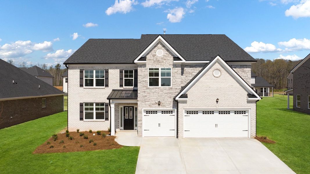 Front exterior of a home in the The Gates at Pates Creek community, located in Hampton, GA (Image 4).
