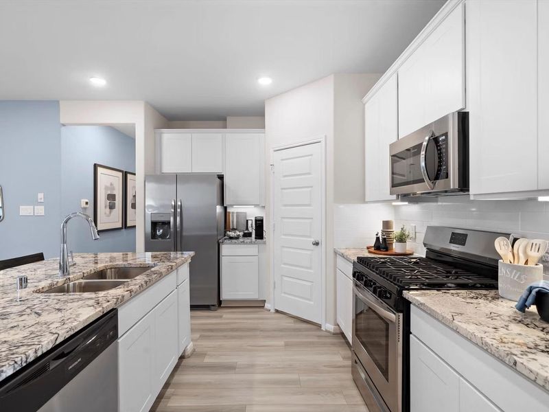 Furnished interior in a model home at Saddle Creek Ranch in Cibolo (Image 6).