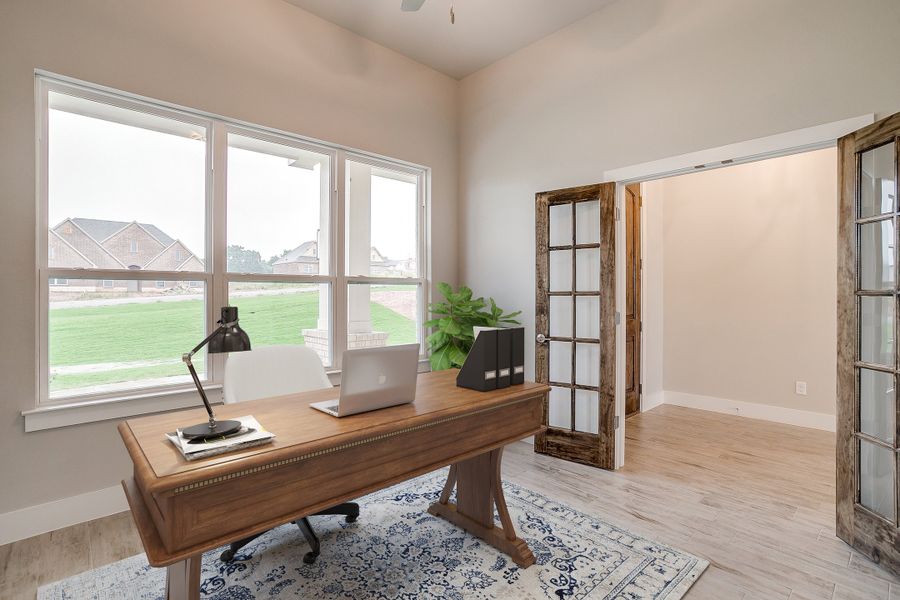 Furnished interior in a model home at Whispering Winds in Springtown (Image 3).
