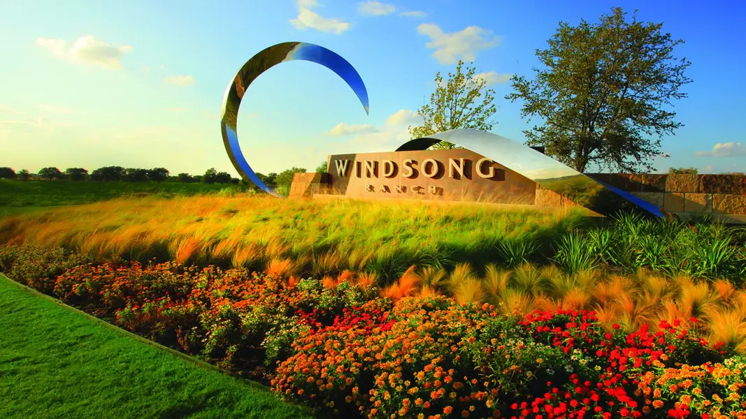 Entrance to the Windsong Ranch community in Prosper, TX, featuring signage and landscaping (Image 2).