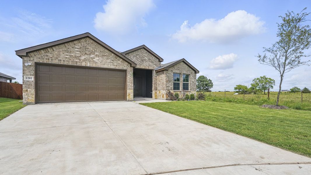 Front exterior of a home in the Leonard Crossing community, located in Leonard, TX (Image 1).