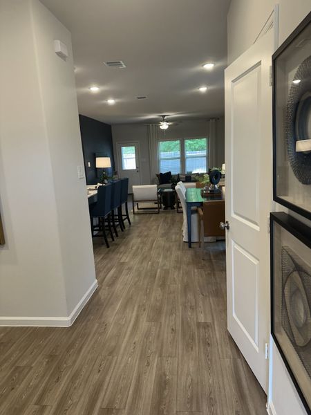 Modern open layout with wood floors, stylish dining area, and cozy living space. A blend of elegance and comfort throughout. Modern open layout with wood floors, stylish dining area, and cozy living space. A blend of elegance and comfort throughout.