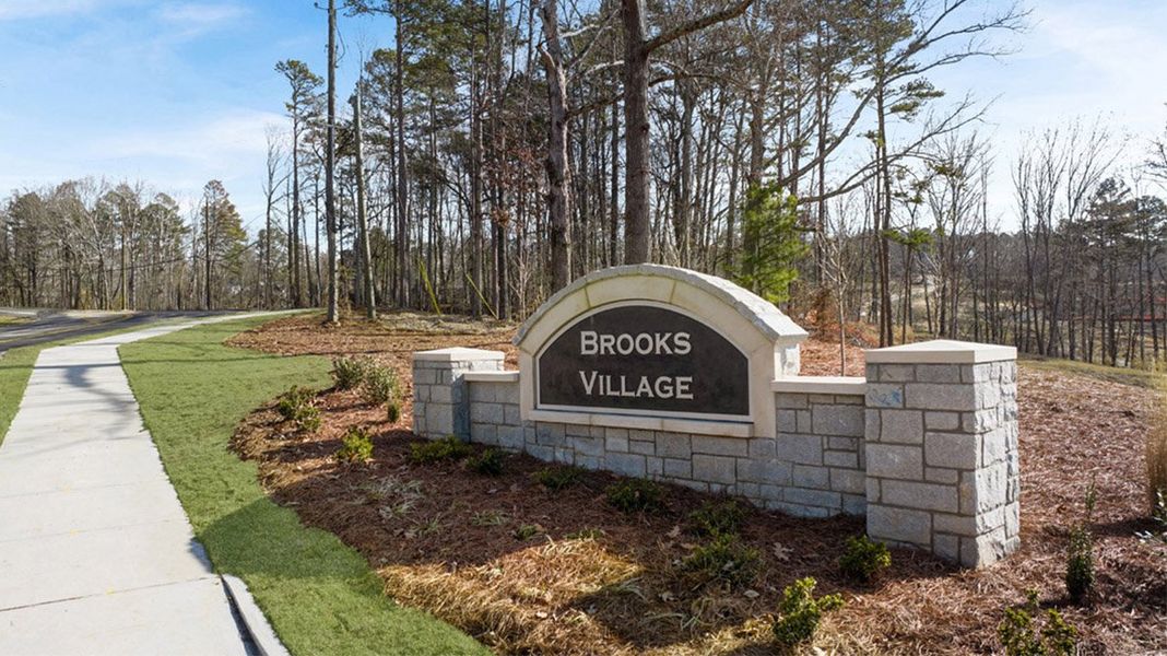 Entrance to the Brooks Village community in Dacula, GA, featuring signage and landscaping (Image 1).