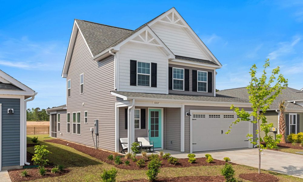 Front exterior of a home in the Bridgewater - Shorehaven Village community, located in Little River, SC (Image 12).