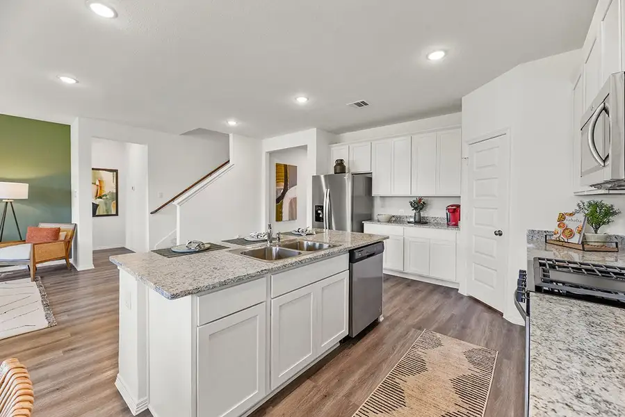 A kitchen with white cabinets. A kitchen with white cabinets.
