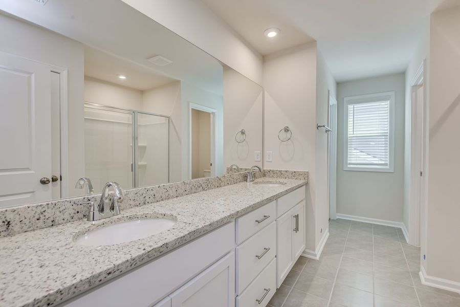 Spa-inspired bathrooms with modern finishes and timeless design