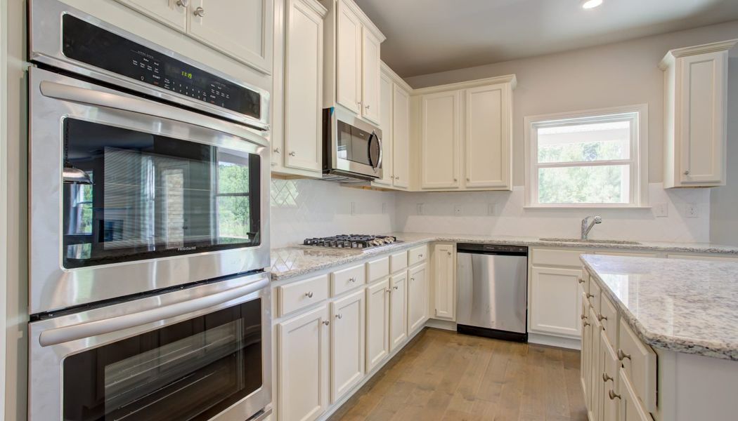 Furnished interior in a model home at Cove Lake Estates in Conley (Image 7).