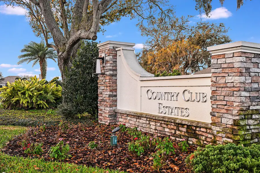 Entrance to the Country Club Estates community in Palm Bay, FL, featuring signage and landscaping (Image 2).