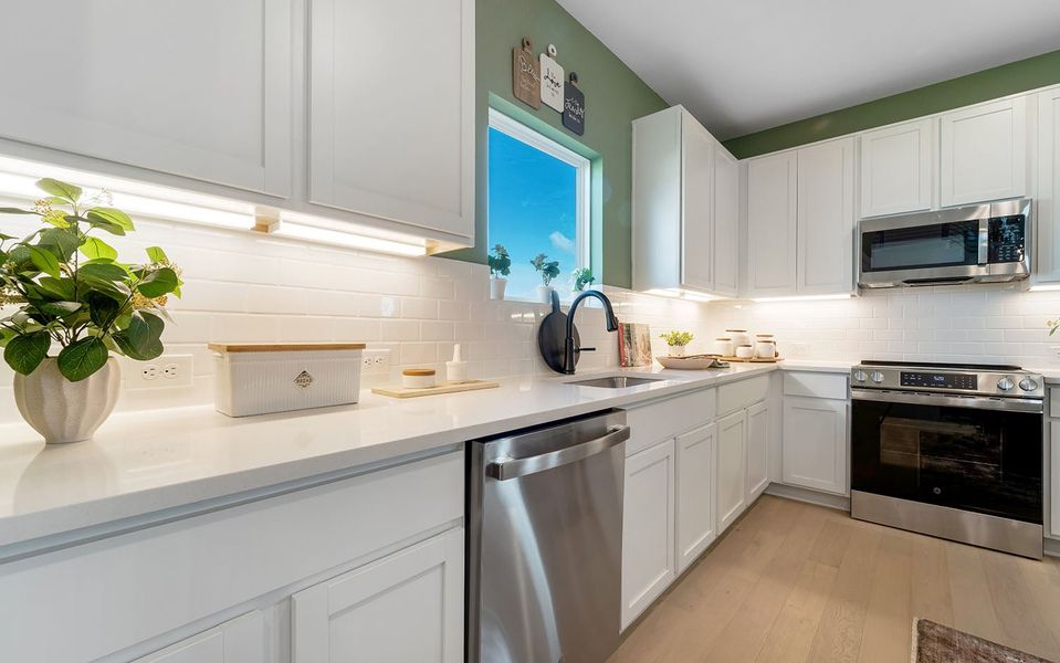 Furnished interior in a model home at Grande Estates in Bertram (Image 26).