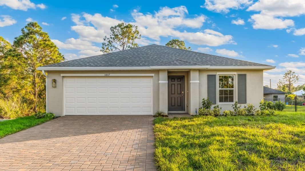 Front exterior of a home in the LaBelle Homes community, located in Lehigh Acres, FL (Image 7).