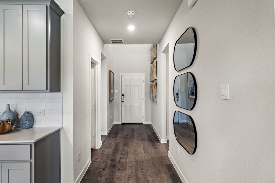 A bathroom with a mirror and sinks.