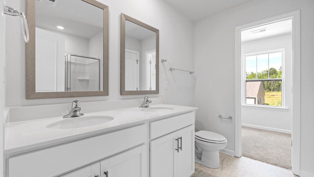 Furnished interior in a model home at Village Grove in Greenville (Image 11).