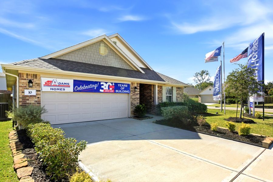 Front exterior of a home in the Kiber Reserve community, located in Angleton, TX (Image 2).