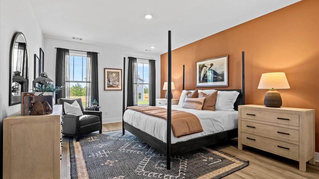 Vibrant natural light fills this exceptional primary suite with eye-catching details Vibrant natural light fills this exceptional primary suite with eye-catching details
