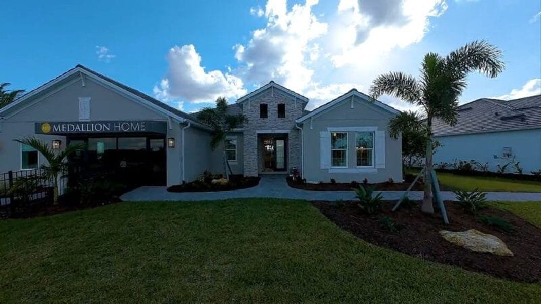 Front exterior of a home in the Artisan at Watercolor Place community, located in Bradenton, FL (Image 56).
