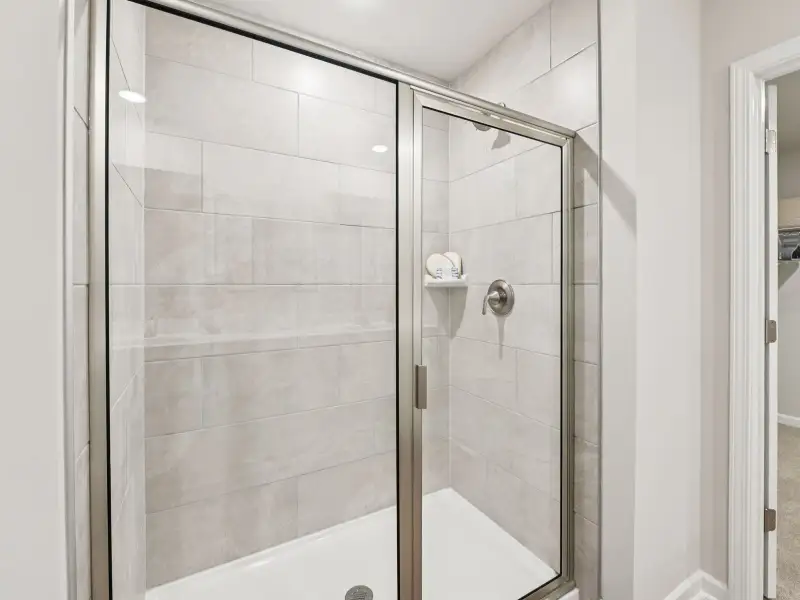 Primary bathroom in the Taylorsville floorplan at a Meritage Homes community in Mebane, NC. Primary bathroom in the Taylorsville floorplan at a Meritage Homes community in Mebane, NC.