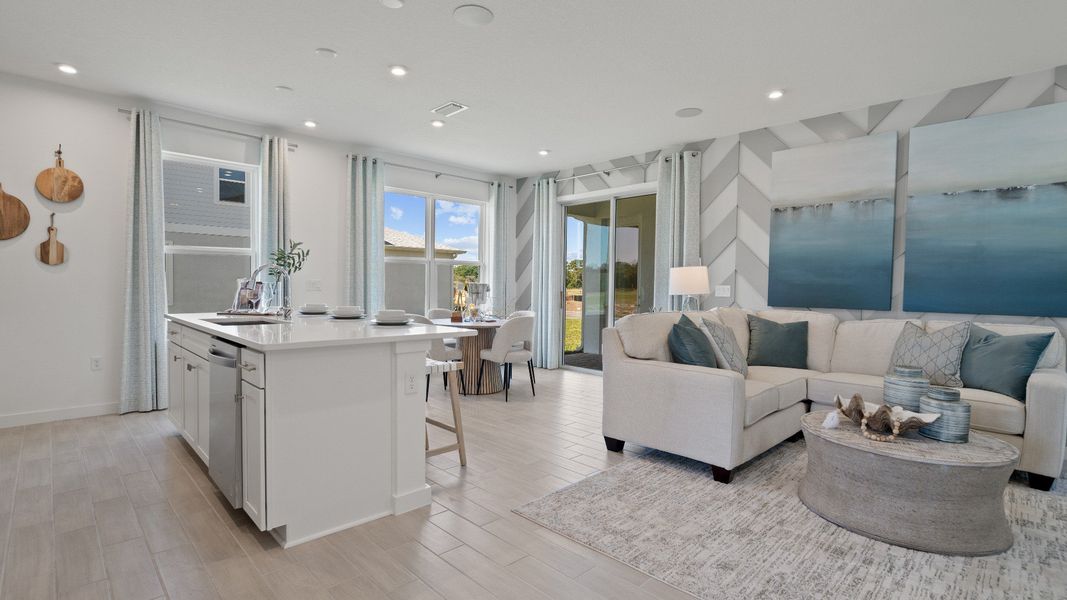 Trinity Place Staged Model Ambersweet Living Area and Kitchen by DRB Homes in Saint Cloud FL Trinity Place Staged Model Ambersweet Living Area and Kitchen by DRB Homes in Saint Cloud FL