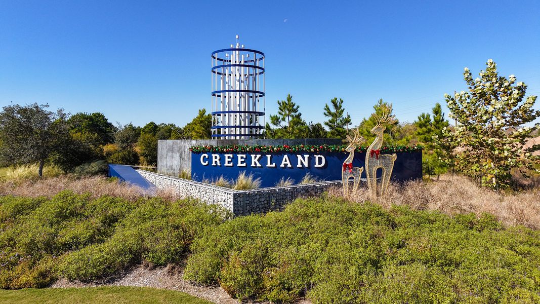 Entrance to the Bridgeland Creekland Village community in Cypress, TX, featuring signage and landscaping (Image 2). Entrance to the Bridgeland Creekland Village community in Cypress, TX, featuring signage and landscaping (Image 2).