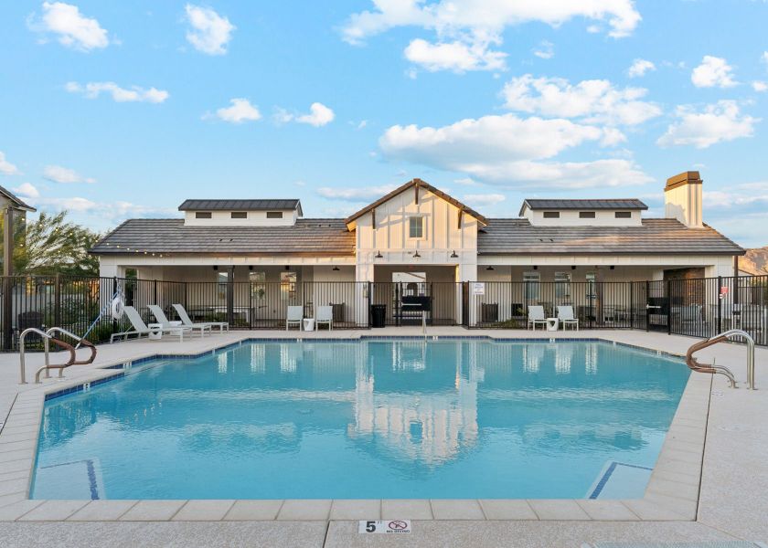 A swimming pool in front of a house. A swimming pool in front of a house.