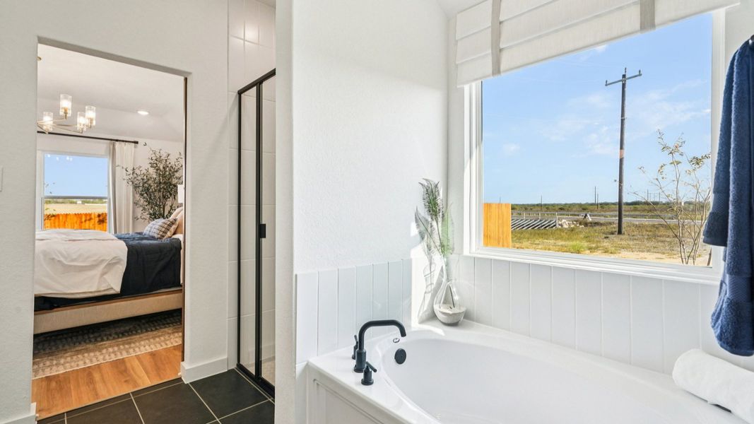 Owner's Bath features separate tub and shower.