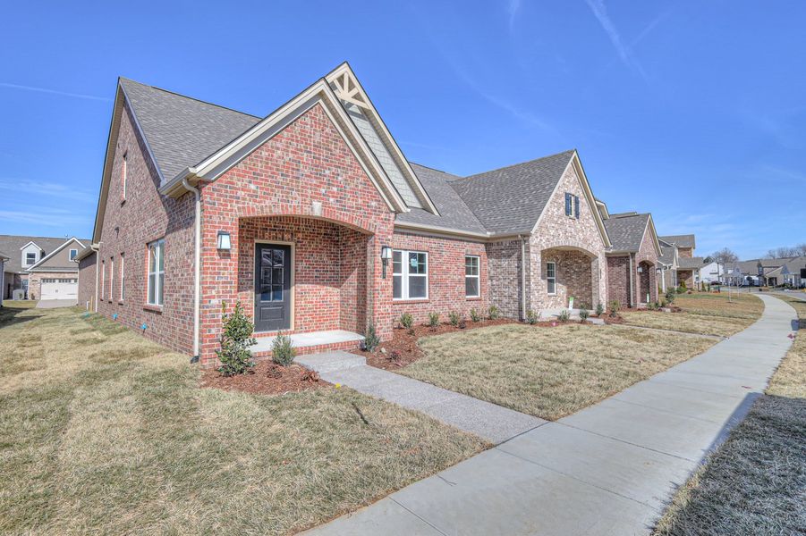 Front exterior of a home in the The Cottages at Waters Edge community, located in Franklin, TN (Image 1).