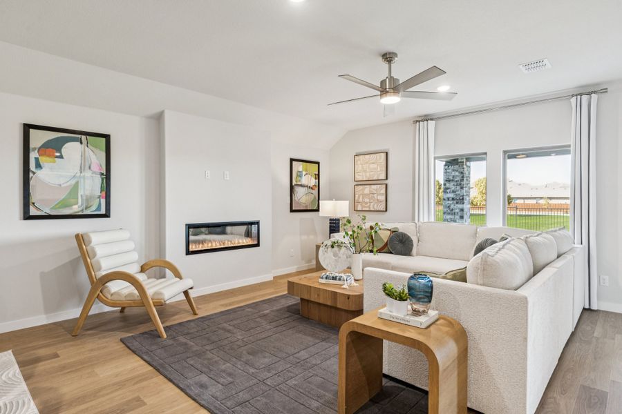 REPRESENTATIVE PHOTO – Living Room in the Oscar model home in Aledo TX by Trophy Signature Homes