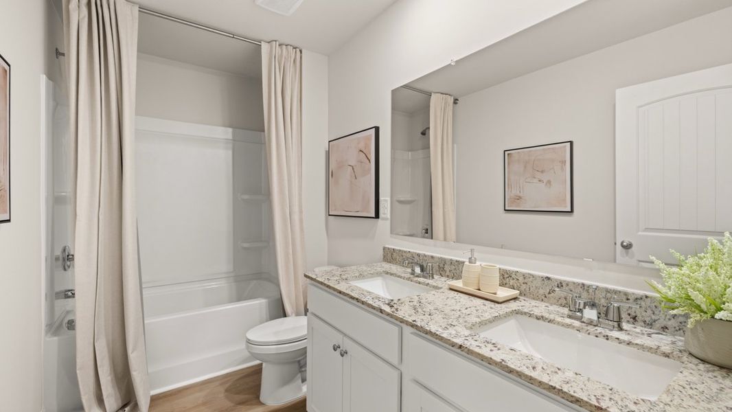 Furnished interior in a model home at South Wind in Fairburn (Image 23).