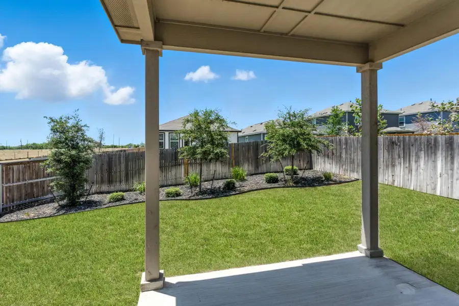 Front exterior of a home in the Blue Ridge Ranch community, located in San Antonio, TX (Image 8).