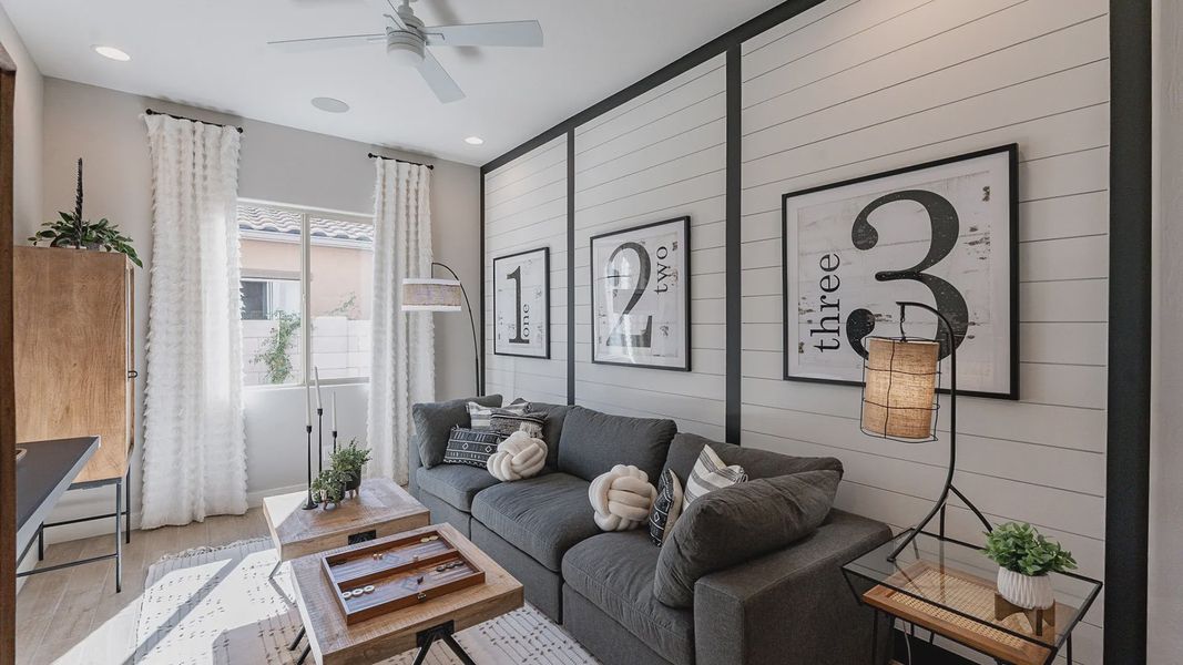 Elegant shiplap walls, plush grey sofa, and sleek wood accents define this Arroyo Seco Hacienda retreat. Elegant shiplap walls, plush grey sofa, and sleek wood accents define this Arroyo Seco Hacienda retreat.