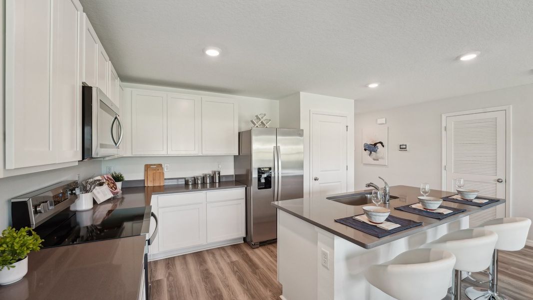 Furnished interior in a model home at Sunset Hills in Summerfield (Image 6).