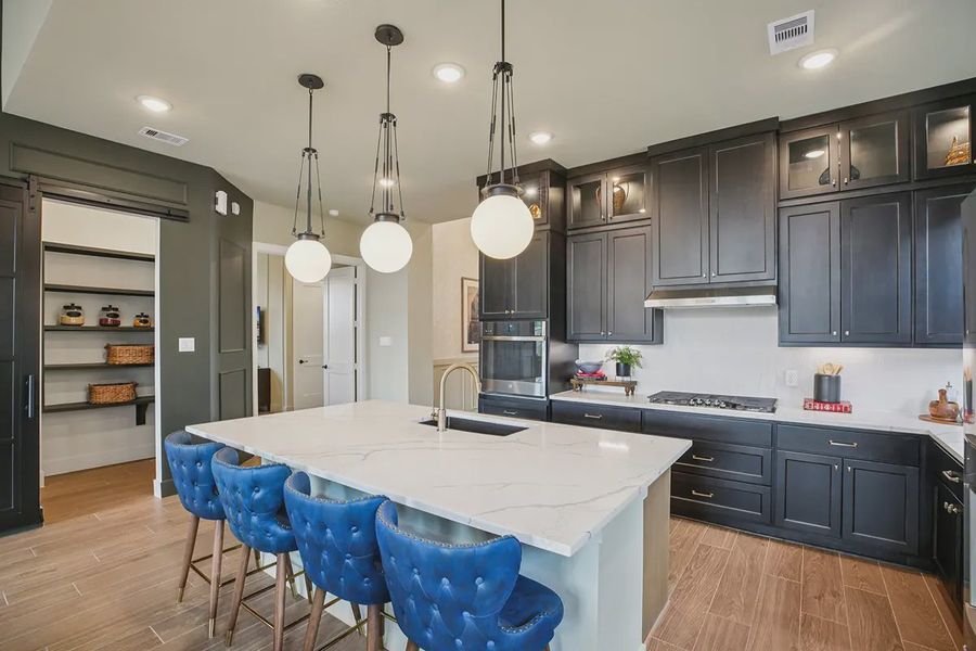 Furnished interior in a model home at Meridiana 50's in Manvel (Image 28).