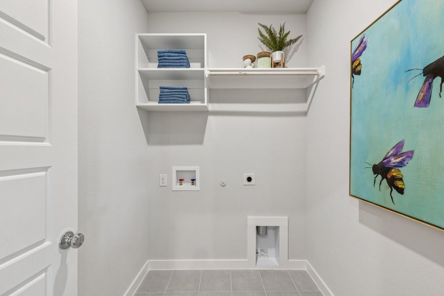 REPRESENTATIVE PHOTO – Utility Room in the Oscar model home in Aledo TX by Trophy Signature Homes
