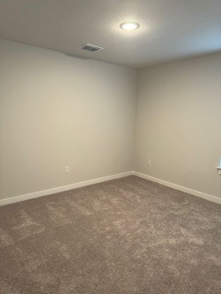 A cozy, carpeted room with soft lighting and neutral walls, ideal for personalization and comfort. A cozy, carpeted room with soft lighting and neutral walls, ideal for personalization and comfort.